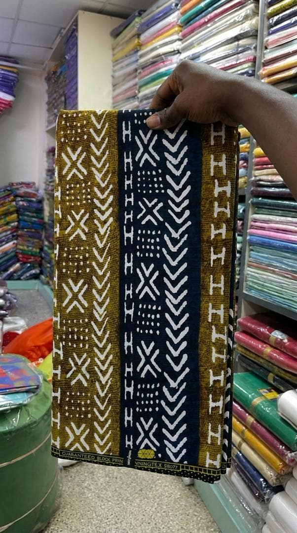 Mustard, navy and white mudcloth print — styled as a bandeau top and wide-leg trousers — the fabric in stock at Zion Vitenge Centre