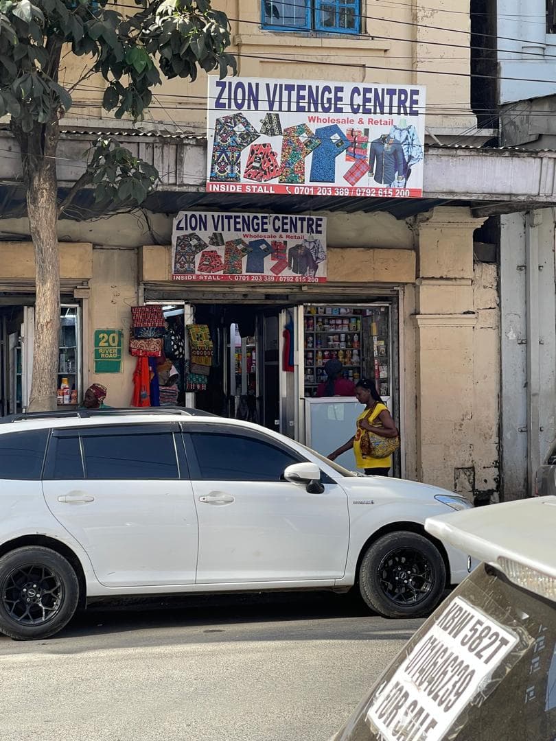 Zion Vitenge Centre shop banner approaching along River Road