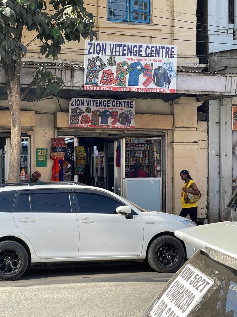 Zion Vitenge Centre banner seen from further along River Road